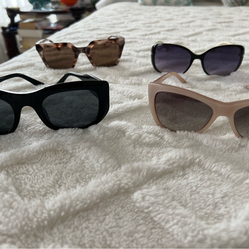 4 pair if sunglasses. Cream are Banana Republic, tortoise shell are LOFT